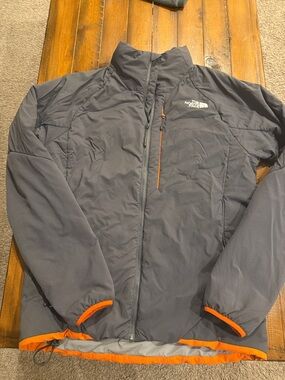 The North Face Men’s Gray Jacket with Orange Accents